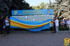 04 серпня 2026 року у Первомайській міській територіальній громаді, біля будівлі Первомайської міської ради, відбулося урочисте відкриття меморіальної дошки на честь військовополонених та зниклих безвісти Захисників України